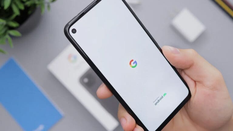 Phone with Google logo on screen, held by hand