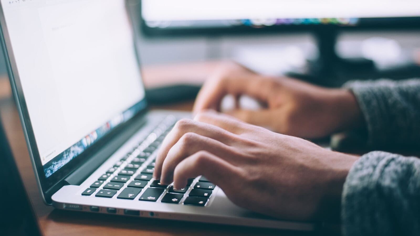 Person typing on a computer