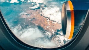 View out the window of an airplane with water underneath