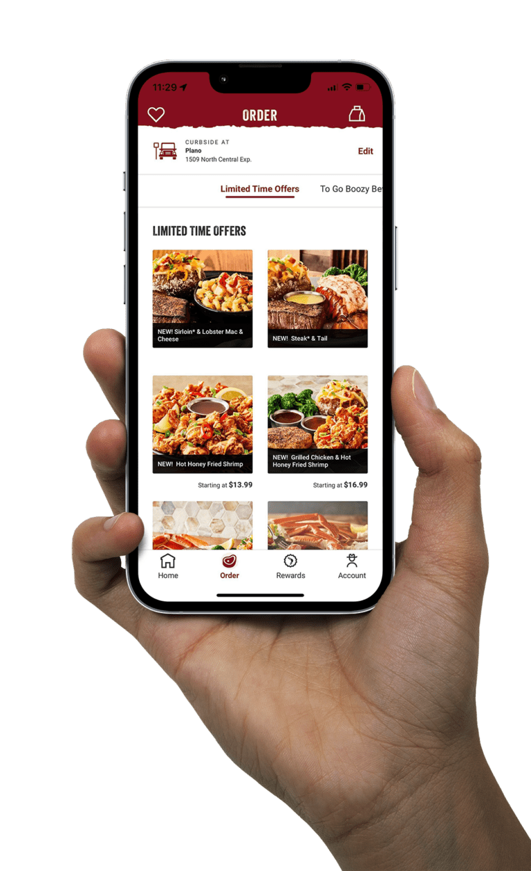 Hand holding phone showing most updated homescreen on the Outback app