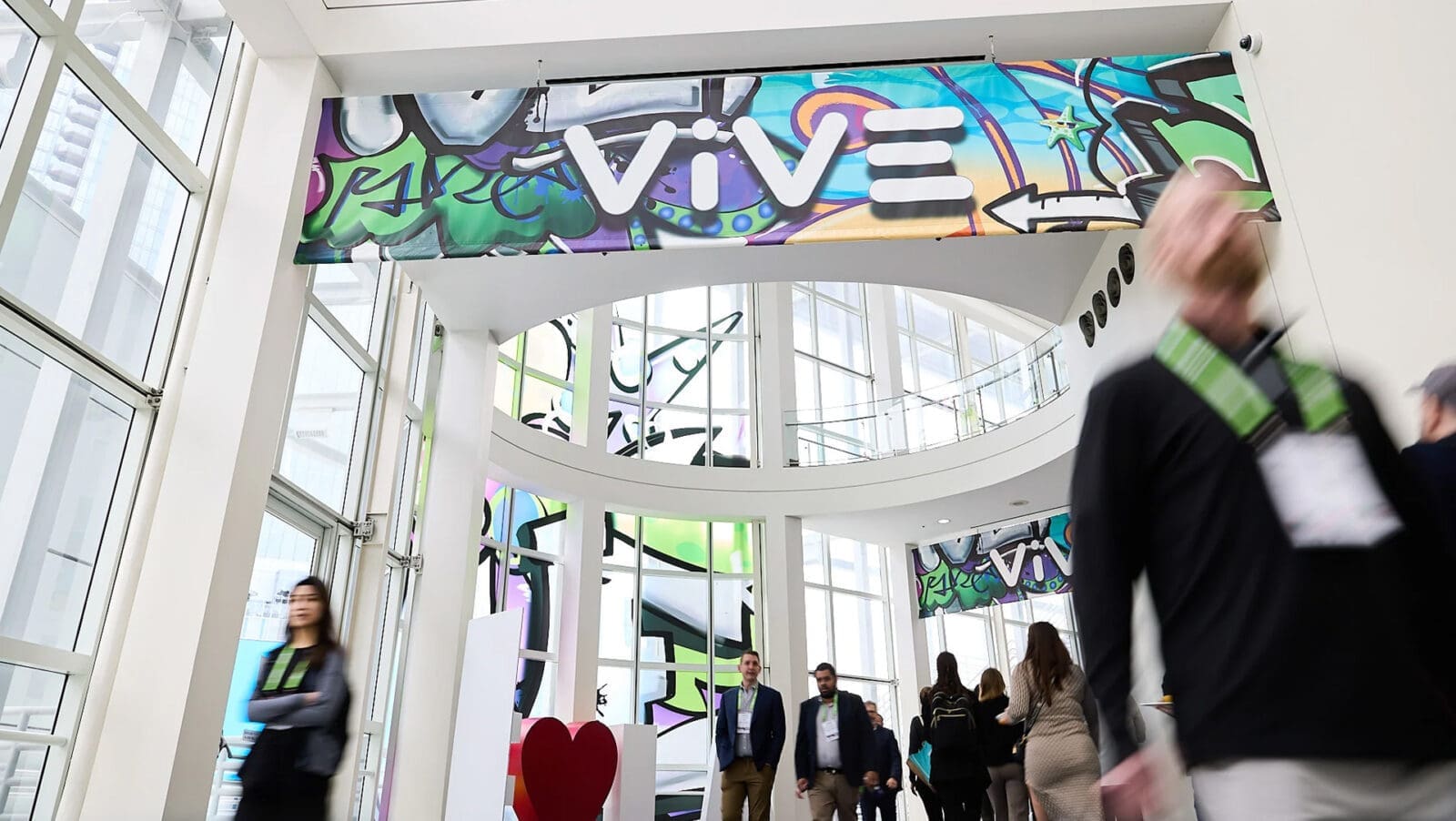 Attendees walking around the hall at the 2024 Vive Conference.